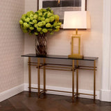Console Table Quinn
Brushed brass finish | smoke glass