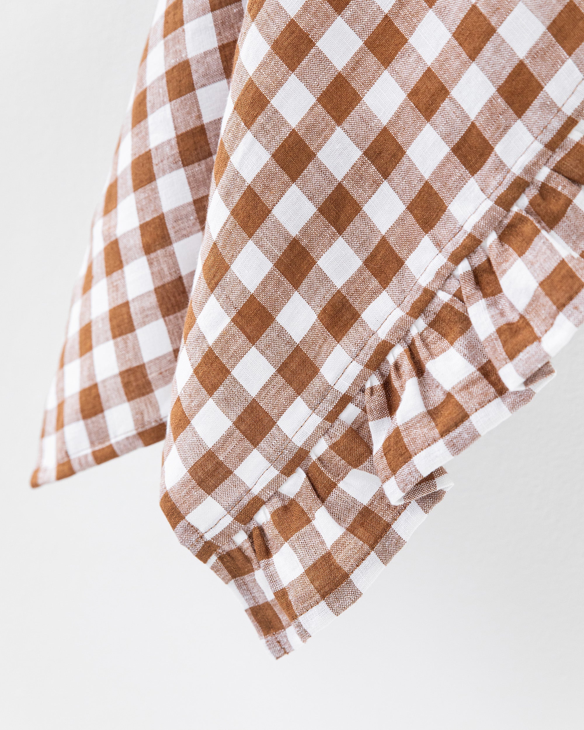 Ruffle trim linen tea towel in Cinnamon gingham