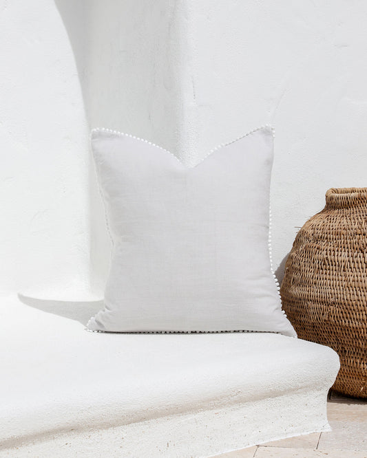 Cushion cover with pom poms in Light gray