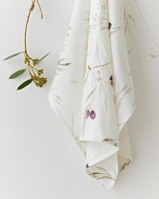 Linen tea towel in Olive orchard print on white