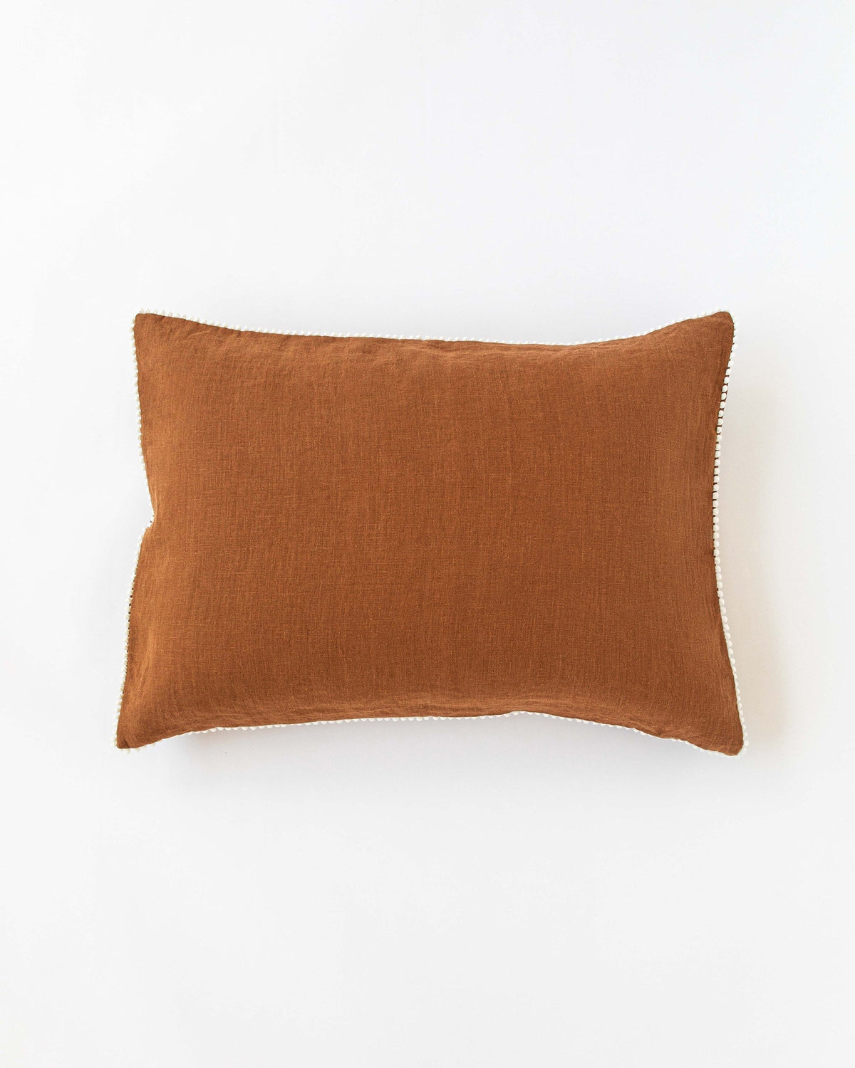 Pom pom trim linen pillowcase in Cinnamon