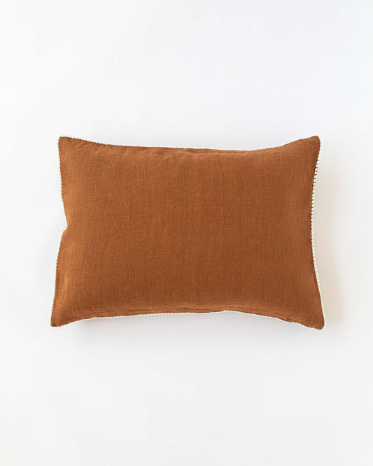 Pom pom trim linen pillowcase in Cinnamon