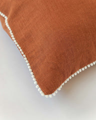 Pom pom trim linen pillowcase in Cinnamon