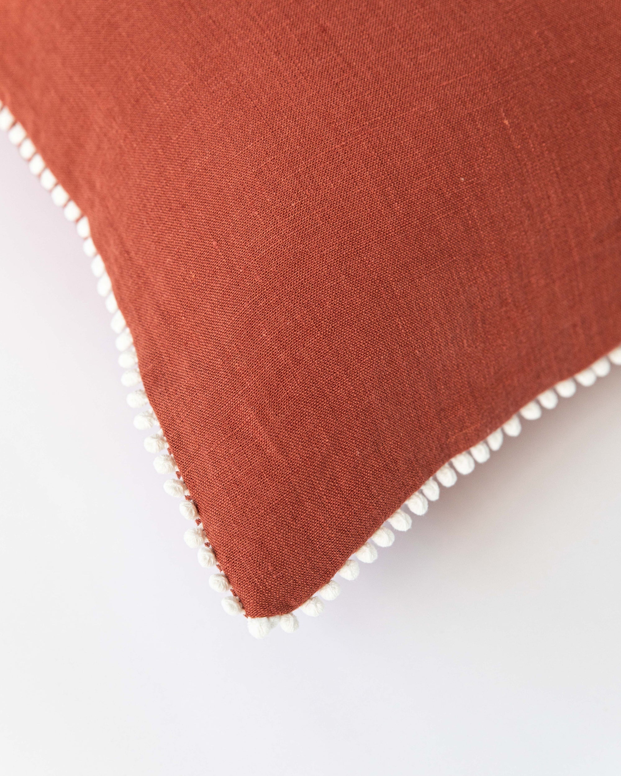 Pom pom trim linen pillowcase in Clay