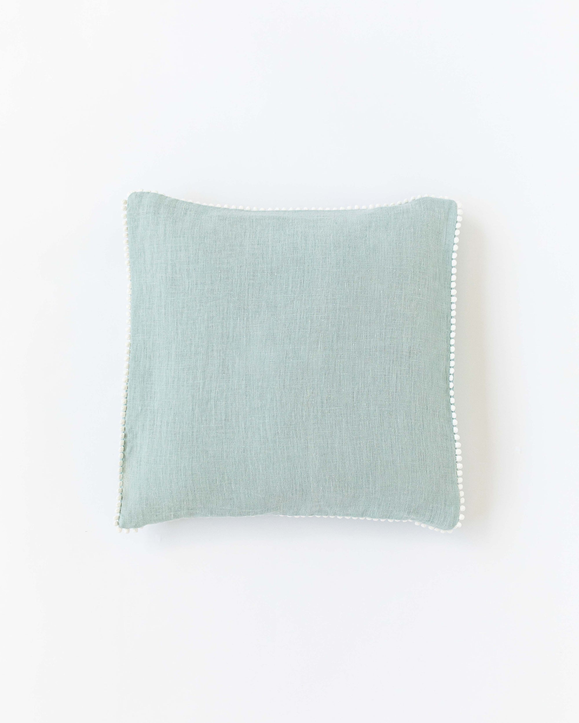 Pom pom trim linen pillowcase in Dusty Blue