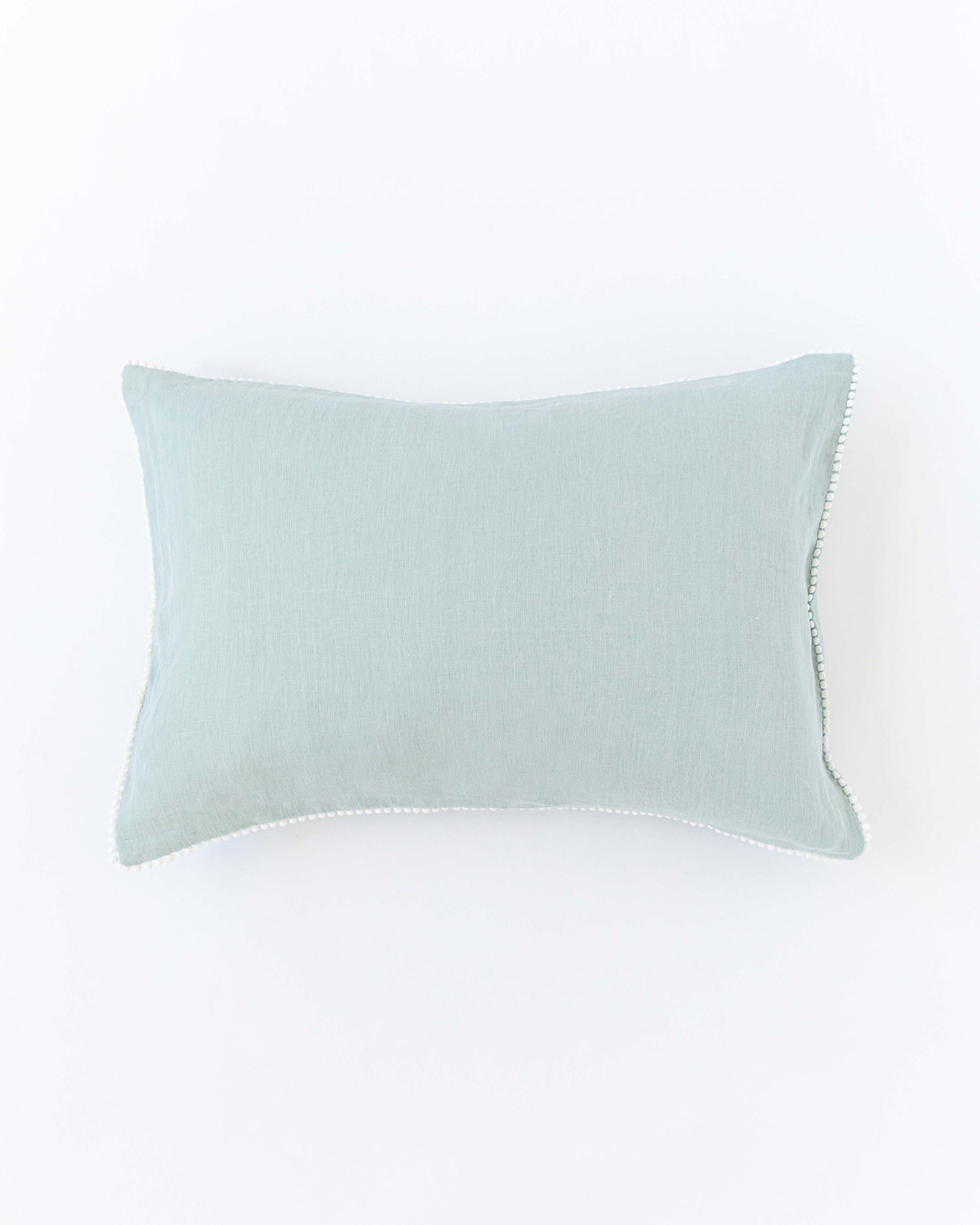 Pom pom trim linen pillowcase in Dusty Blue