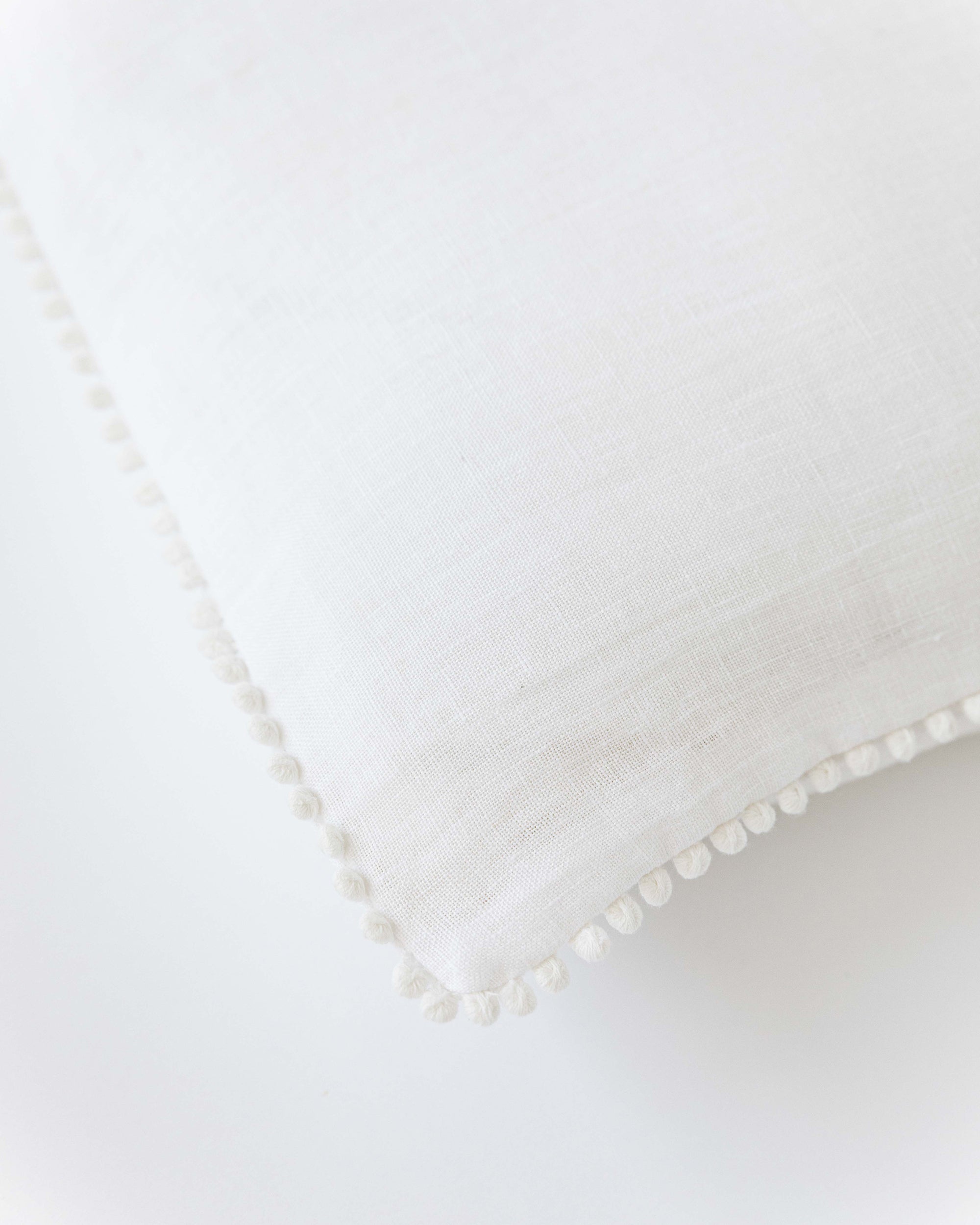 Pom pom trim linen pillowcase in White