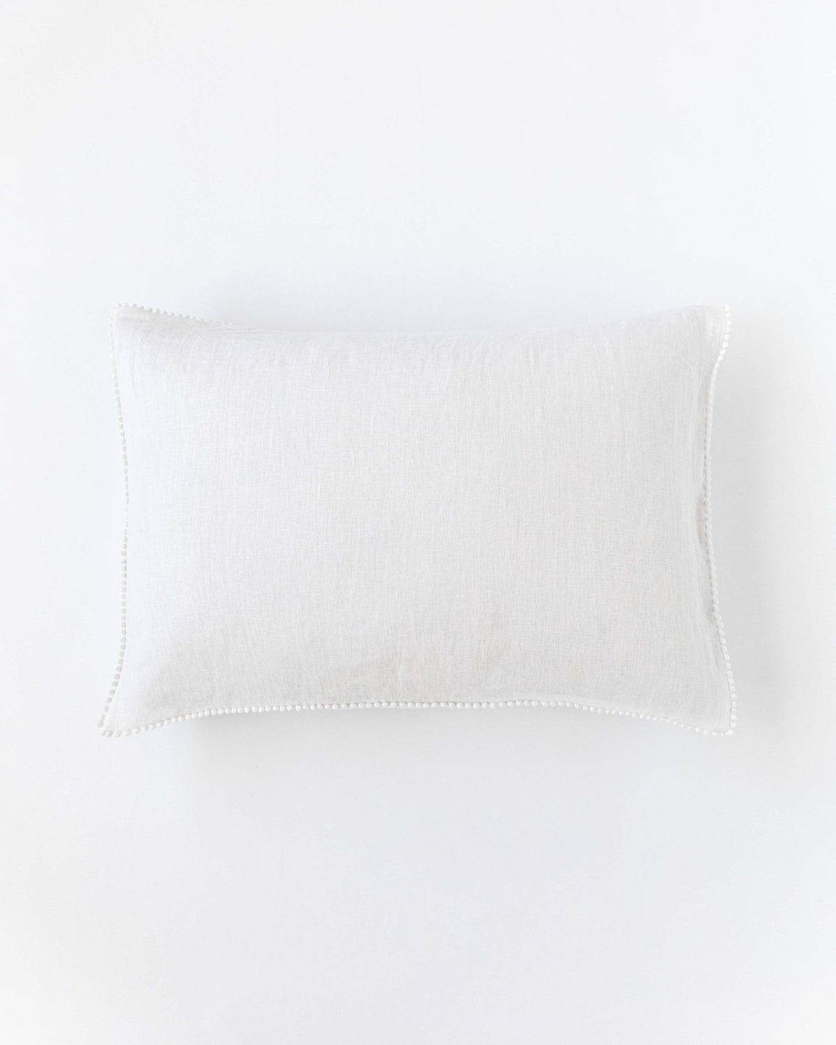 Pom pom trim linen pillowcase in White