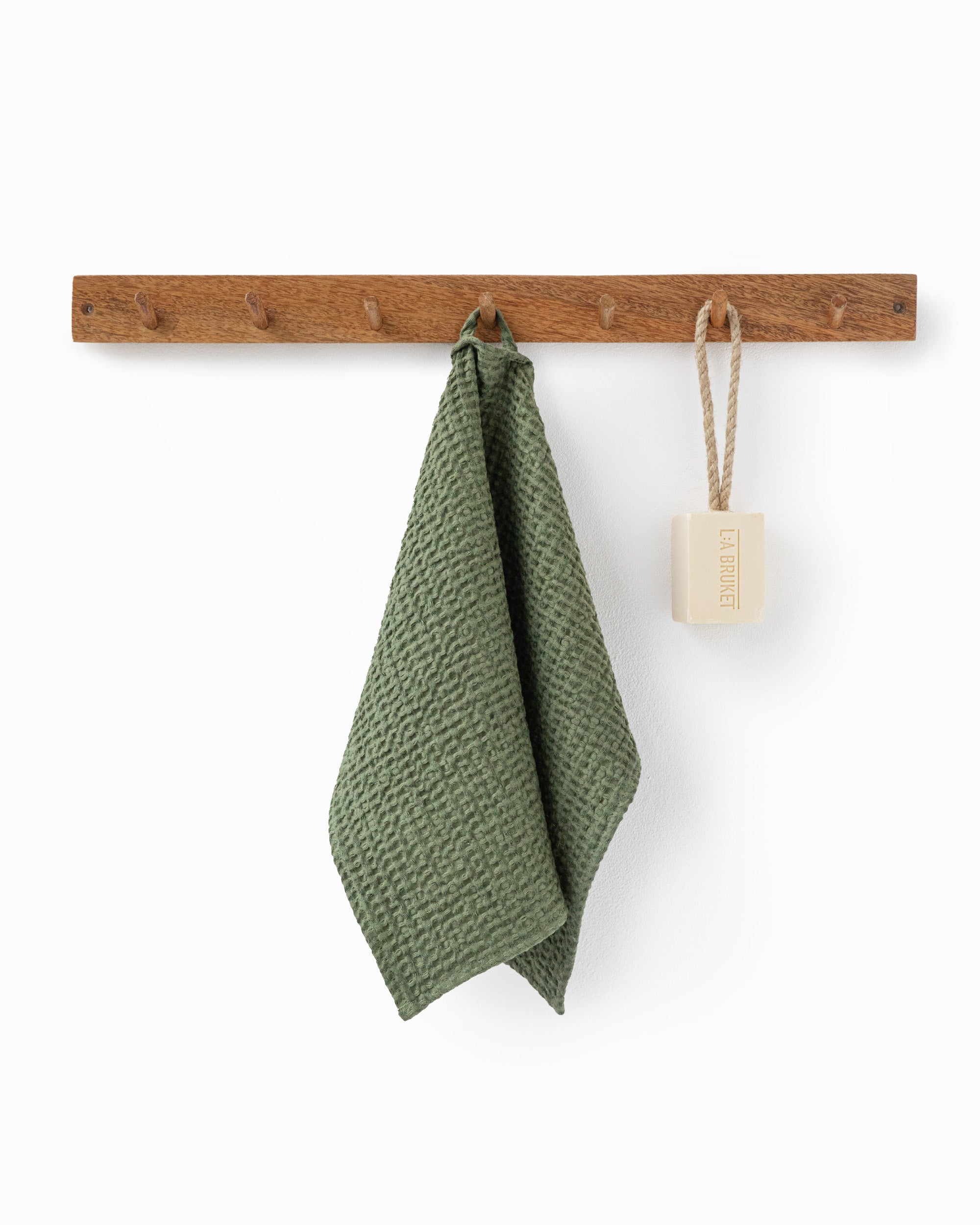 Waffle face towel in Forest green